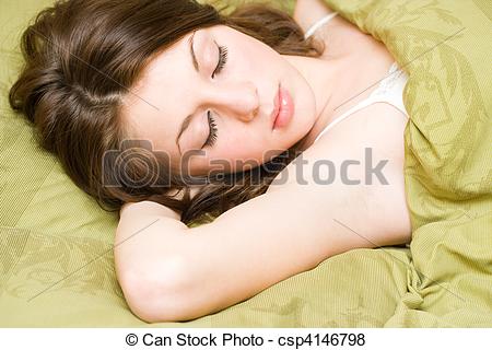Naked young girl sleeping on bed