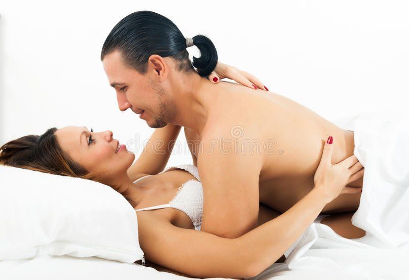 Man and girl haven sex in bed