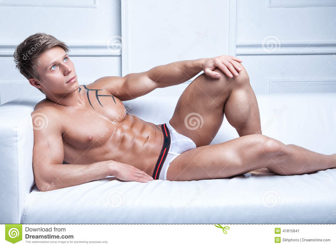 Sexy young men laying in bed nake