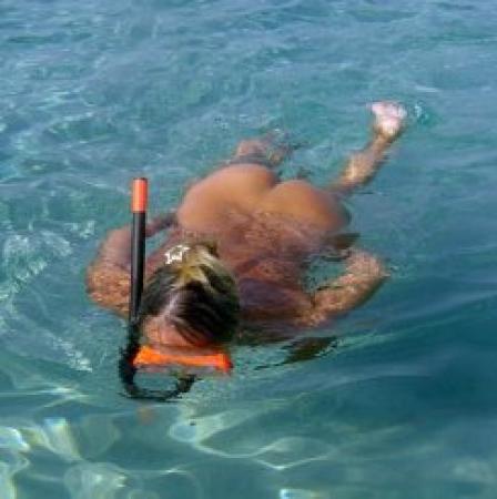Young nudist snorkel