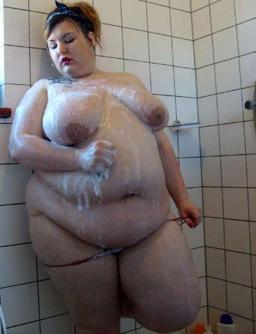 Nude fat women taking a shower