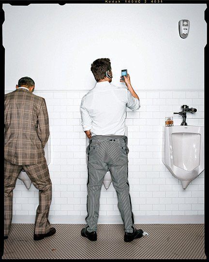 Guys peeing in urinals