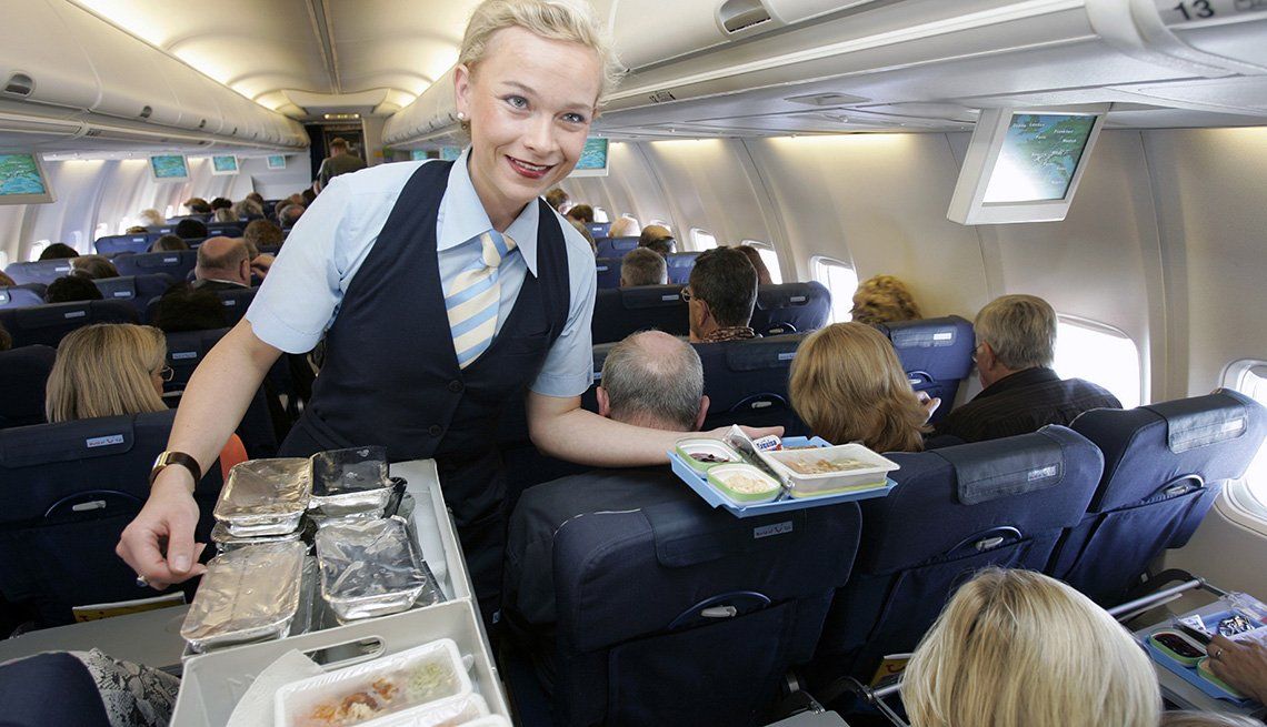 Flight attendant giving hand jobs